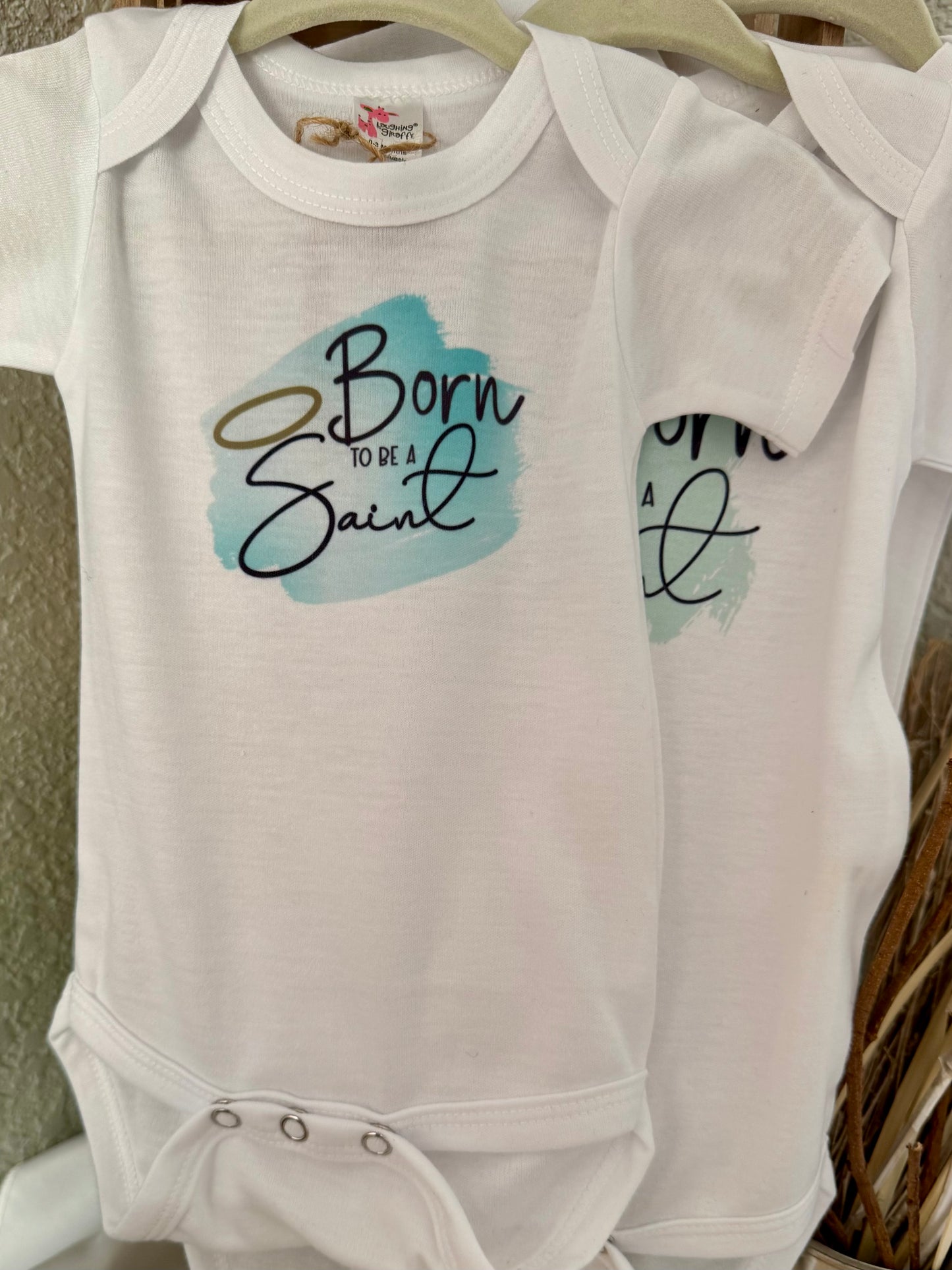 Born to Be a Saint Baby Onesie - Laughing Giraffe