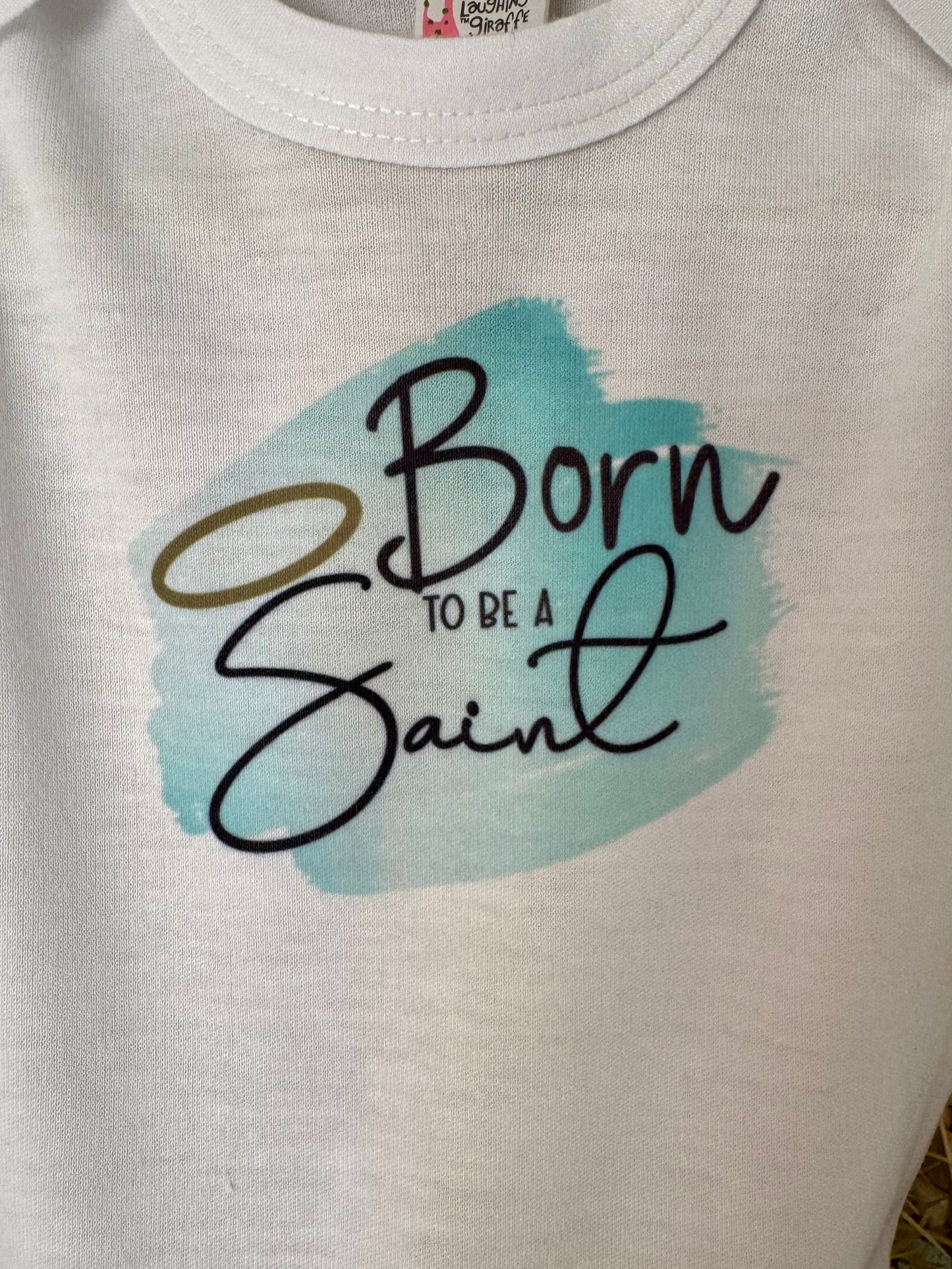 Born to Be a Saint Baby Onesie - Laughing Giraffe
