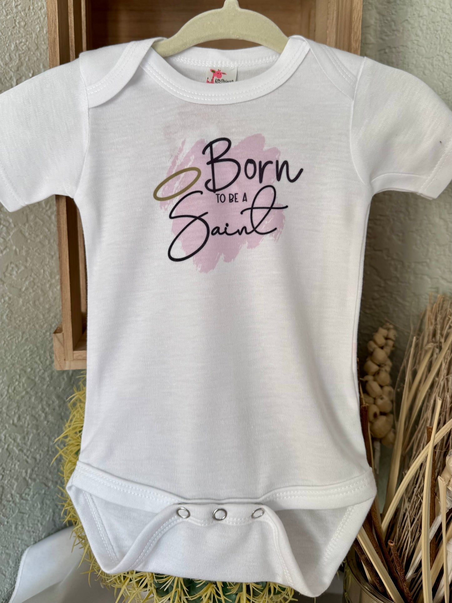 Born to Be a Saint Baby Onesie - Laughing Giraffe