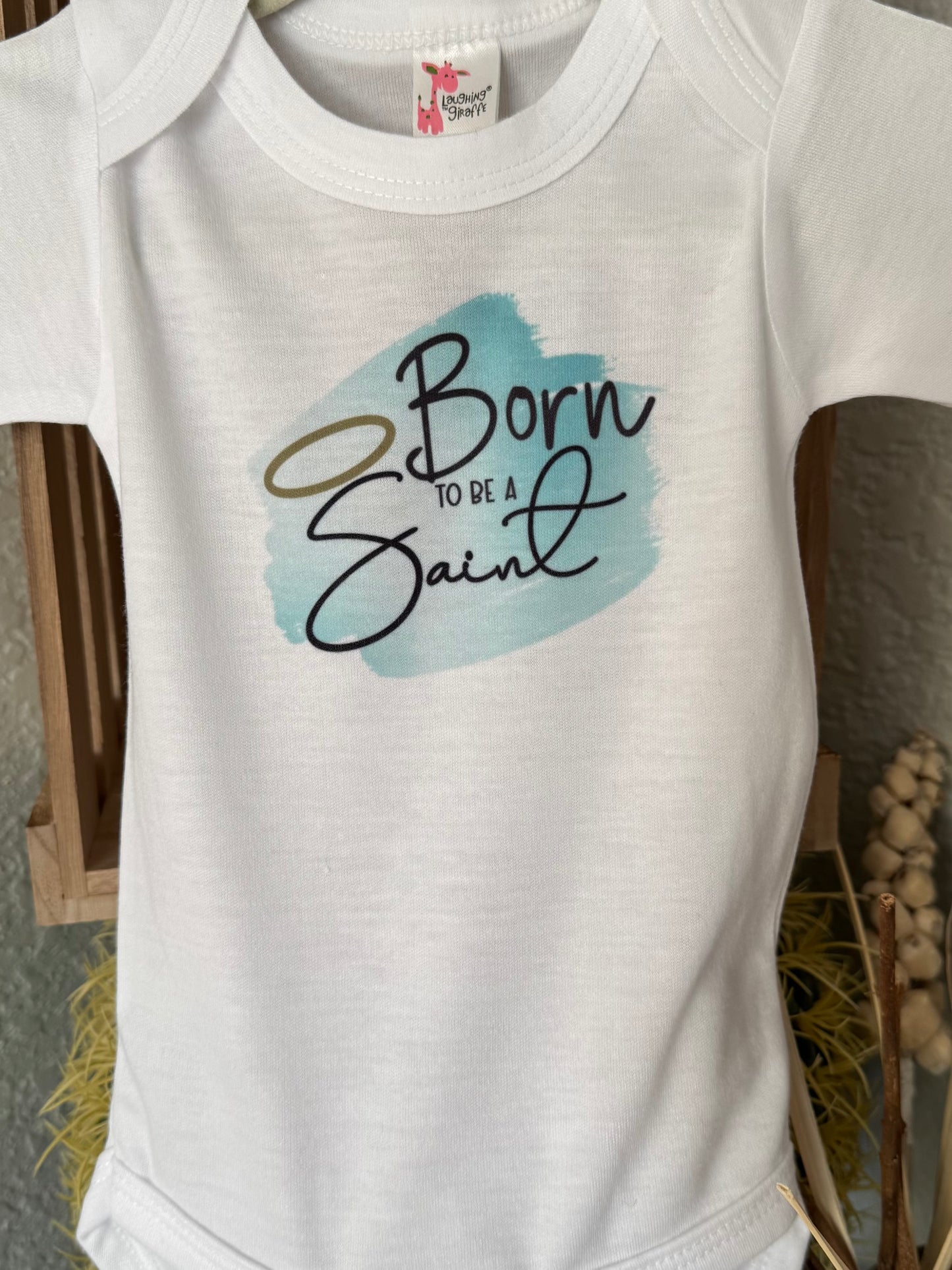 Born to Be a Saint Baby Onesie - Laughing Giraffe