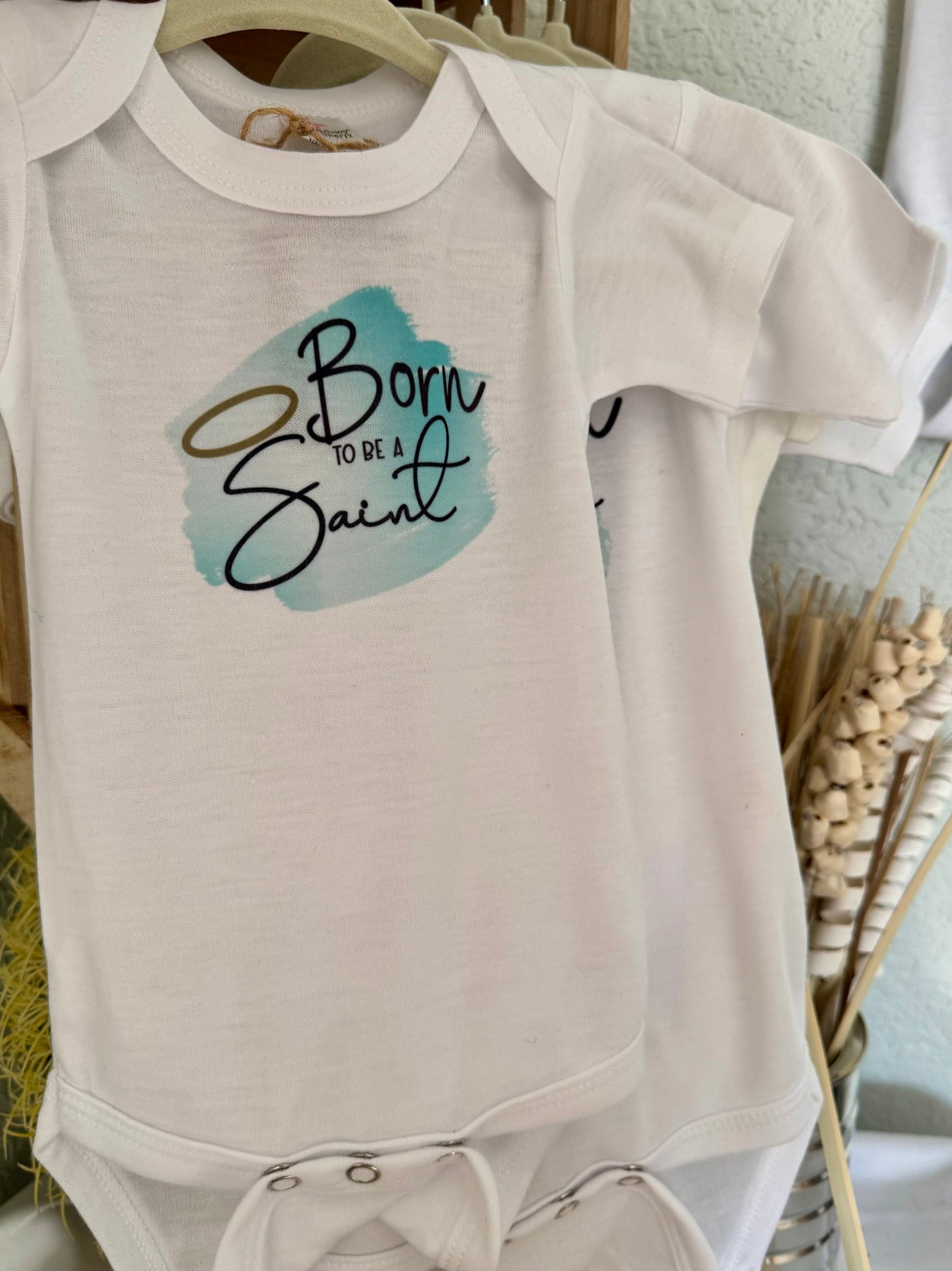 Born to Be a Saint Baby Onesie - Laughing Giraffe