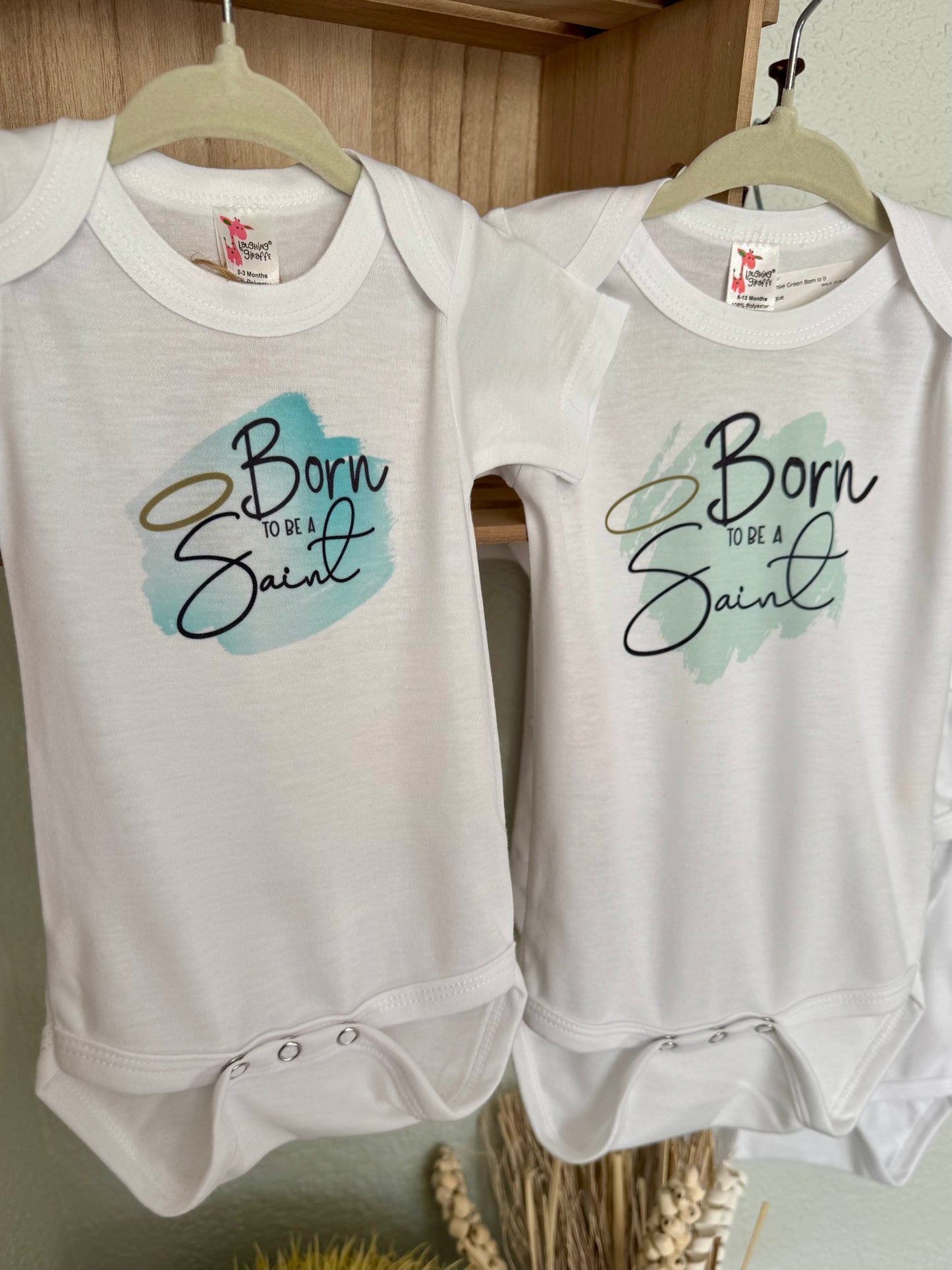 Born to Be a Saint Baby Onesie - Laughing Giraffe