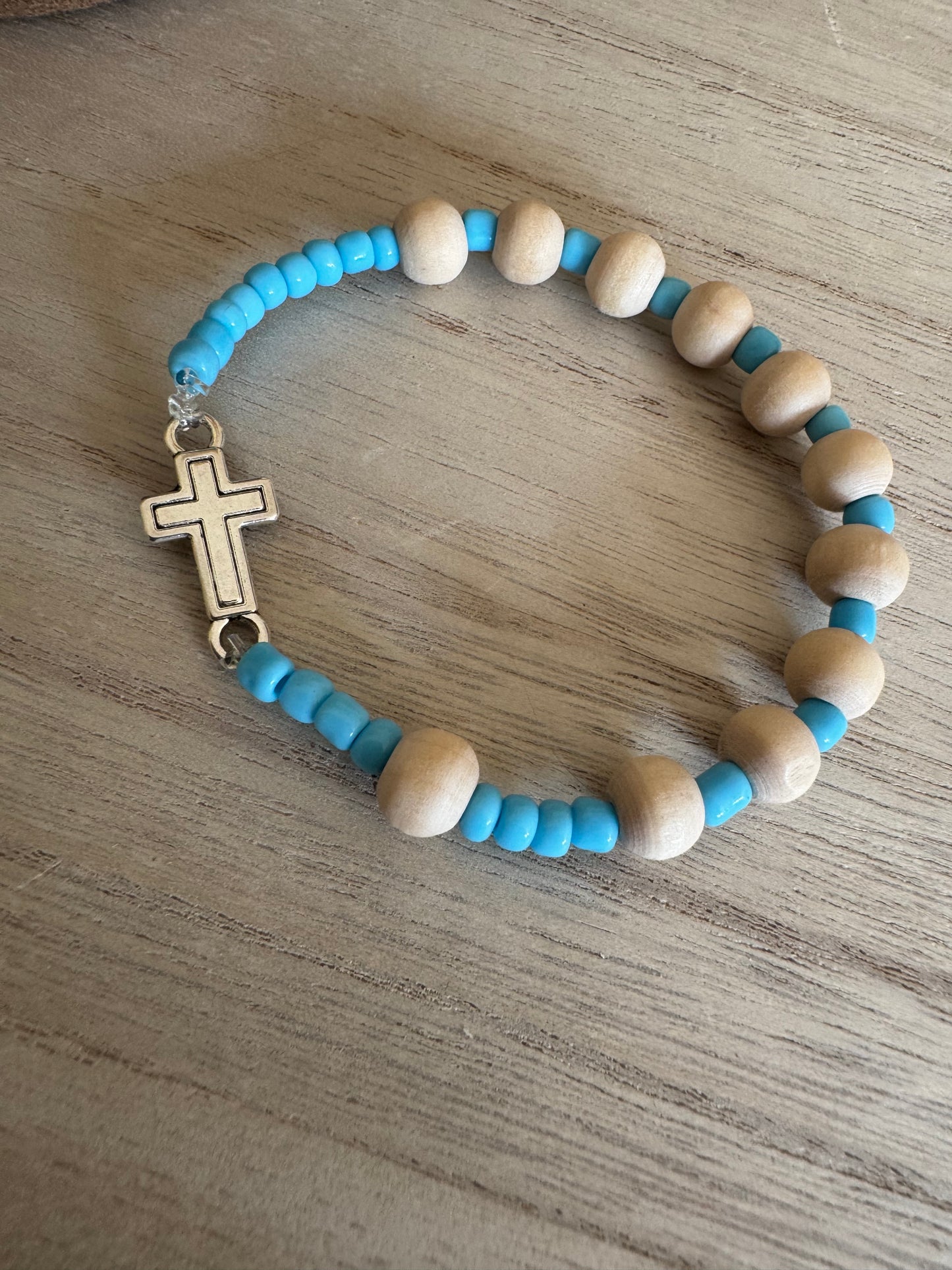 Handmade Rosary Bracelet – Natural Wood, Teal Seed Beads & Silver Cross