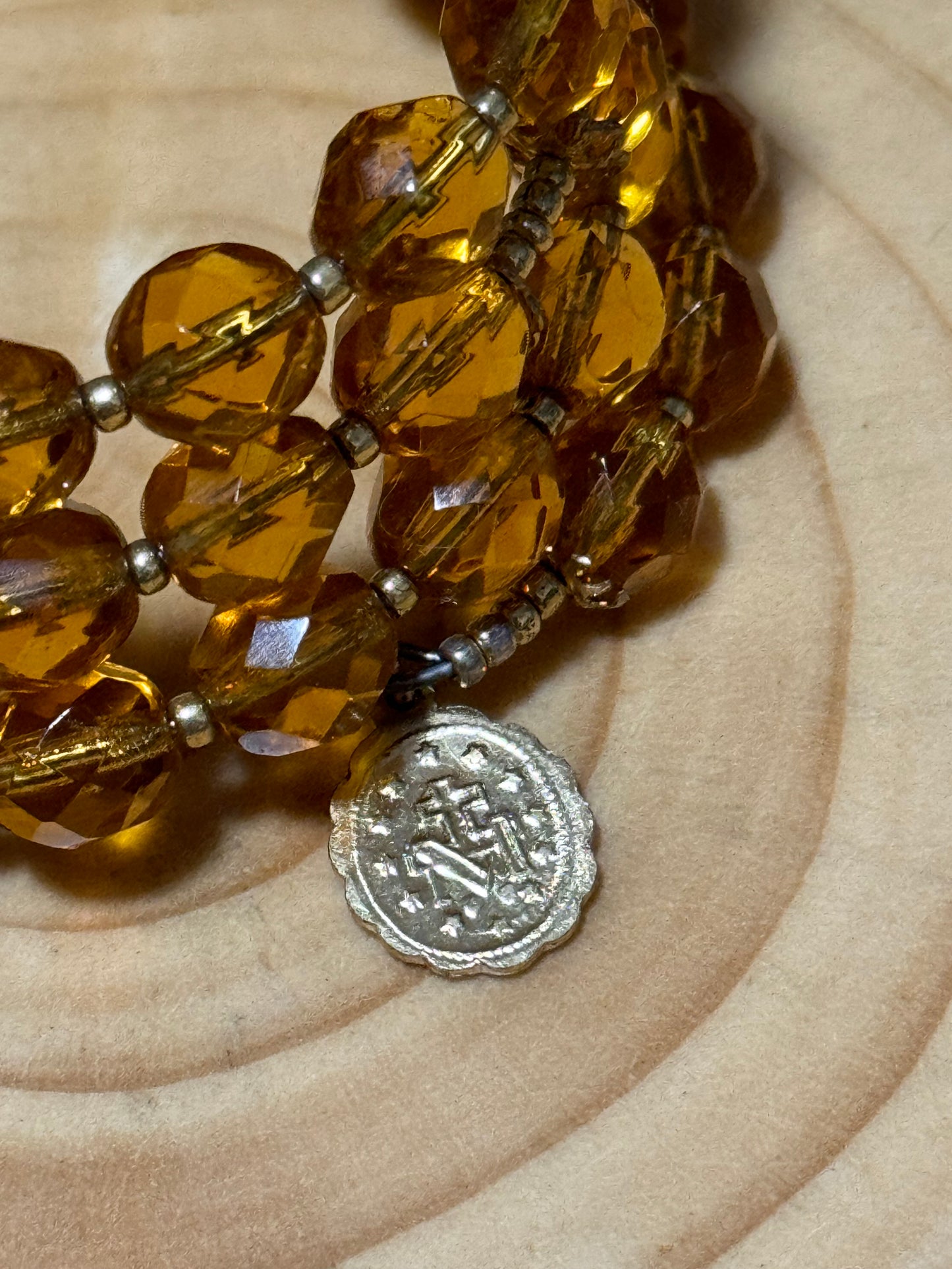 Orange wire wrap rosary bracelet