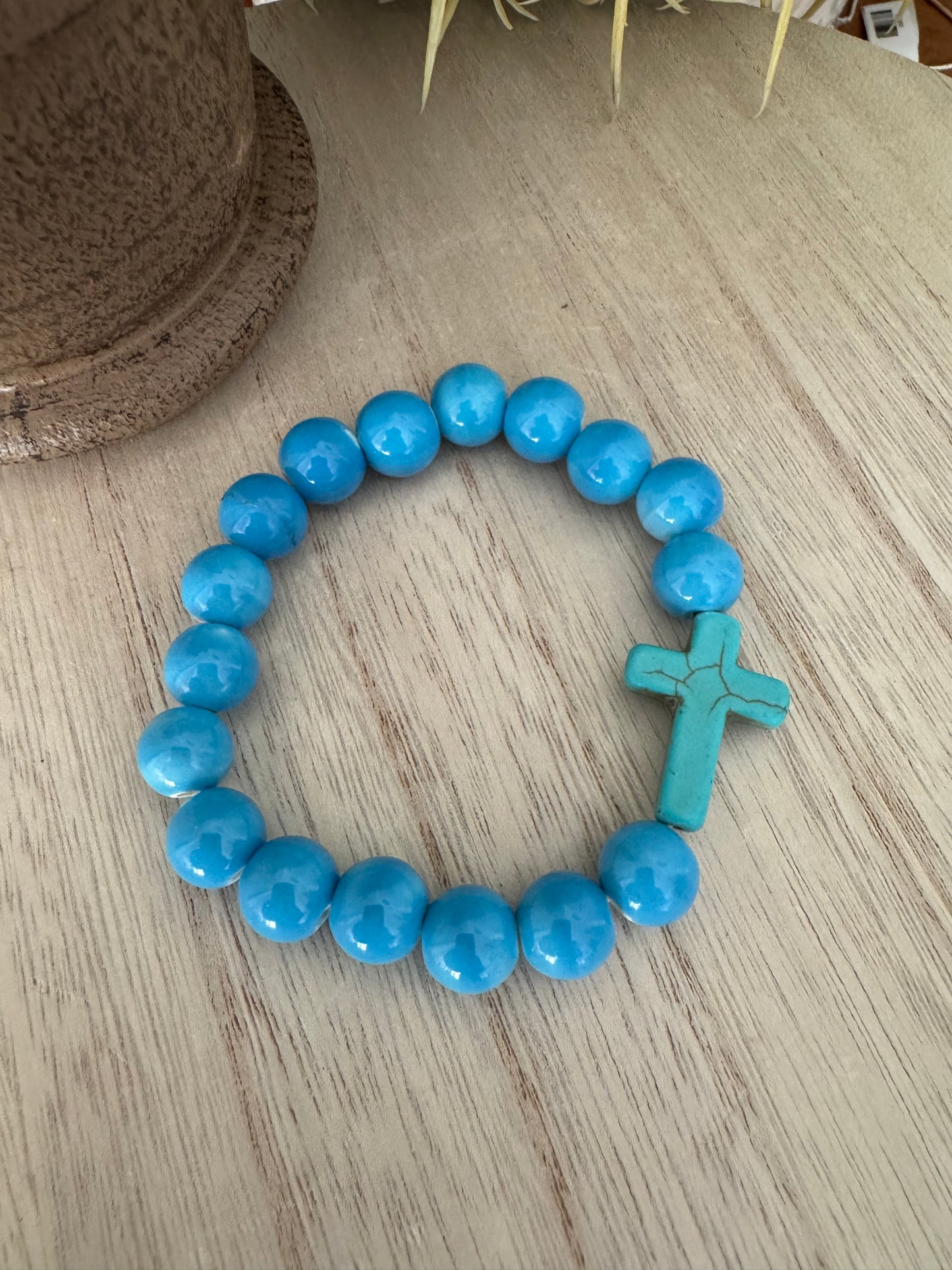 Blue Beaded Stretch Bracelet with Teal Cracked Cross – 7 Inches
