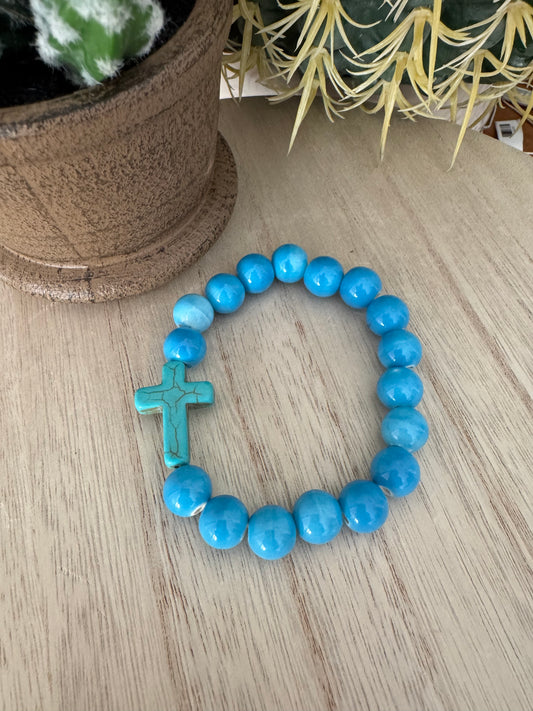 Blue Beaded Stretch Bracelet with Teal Cracked Cross – 7 Inches