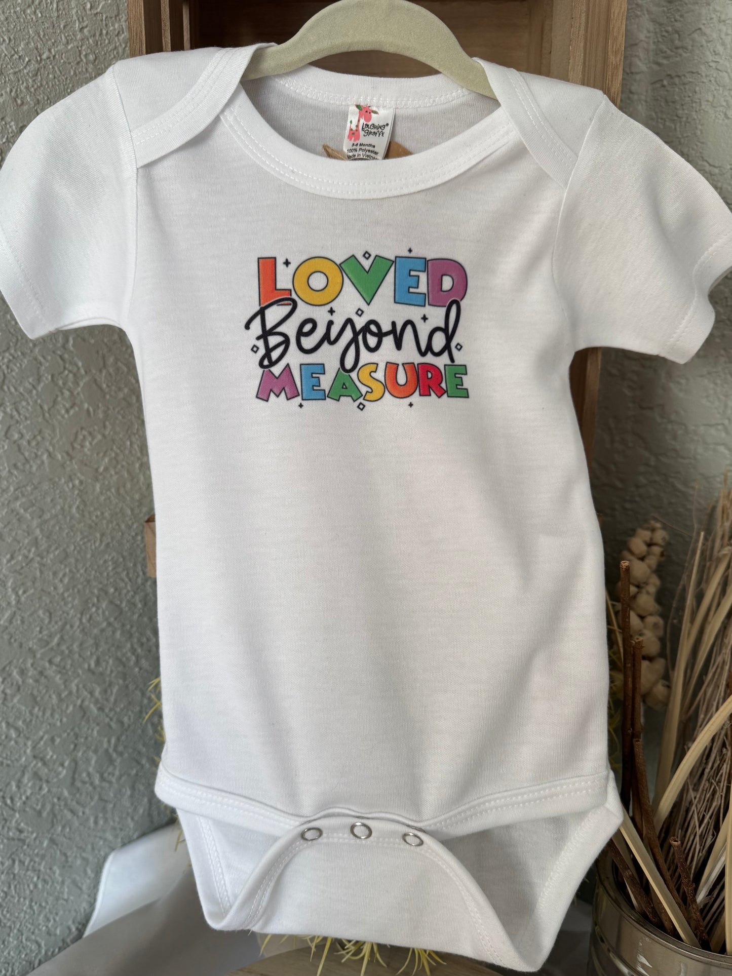 Loved Beyond Measure Baby Onesie