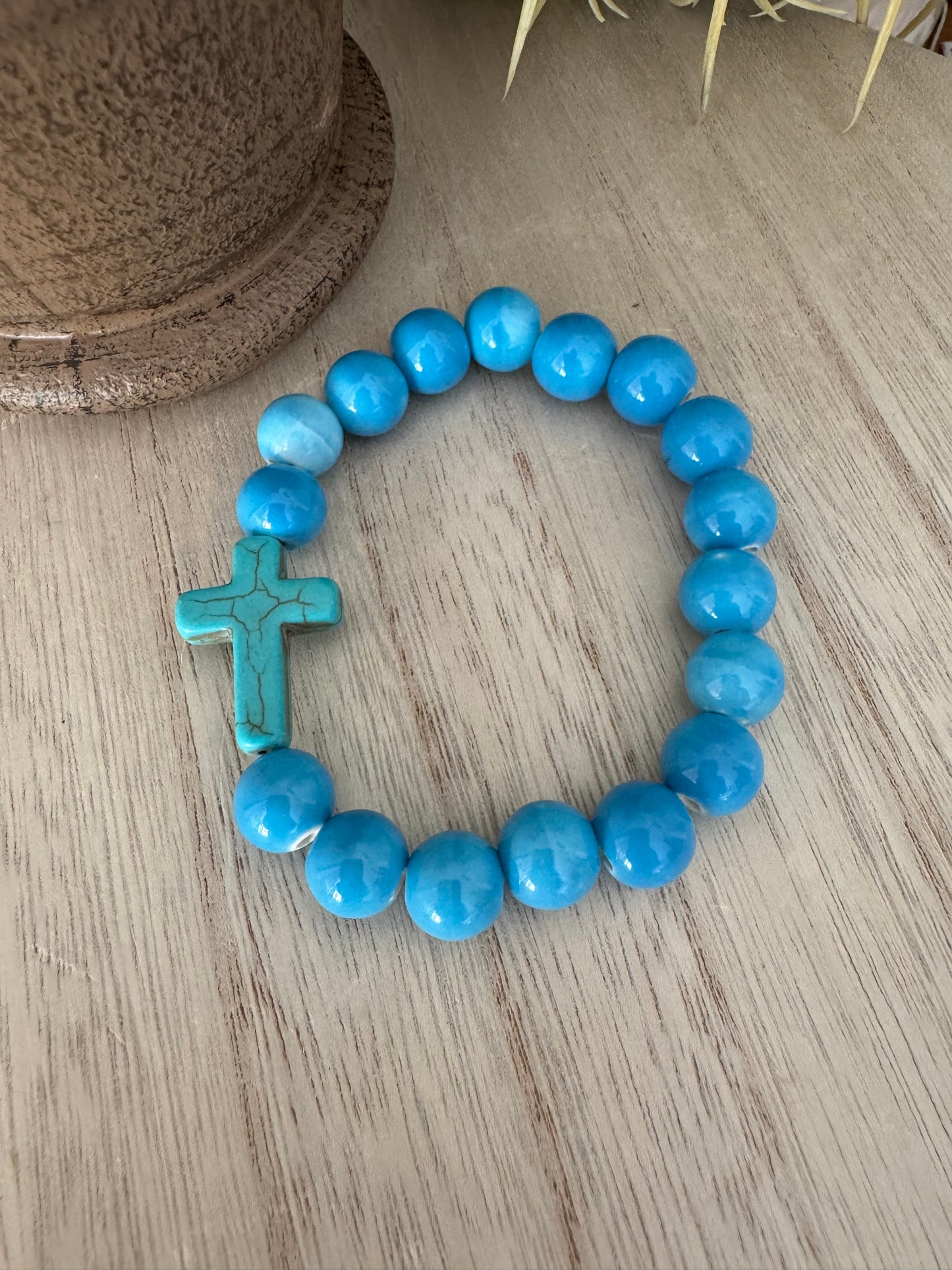 Blue Beaded Stretch Bracelet with Teal Cracked Cross – 7 Inches