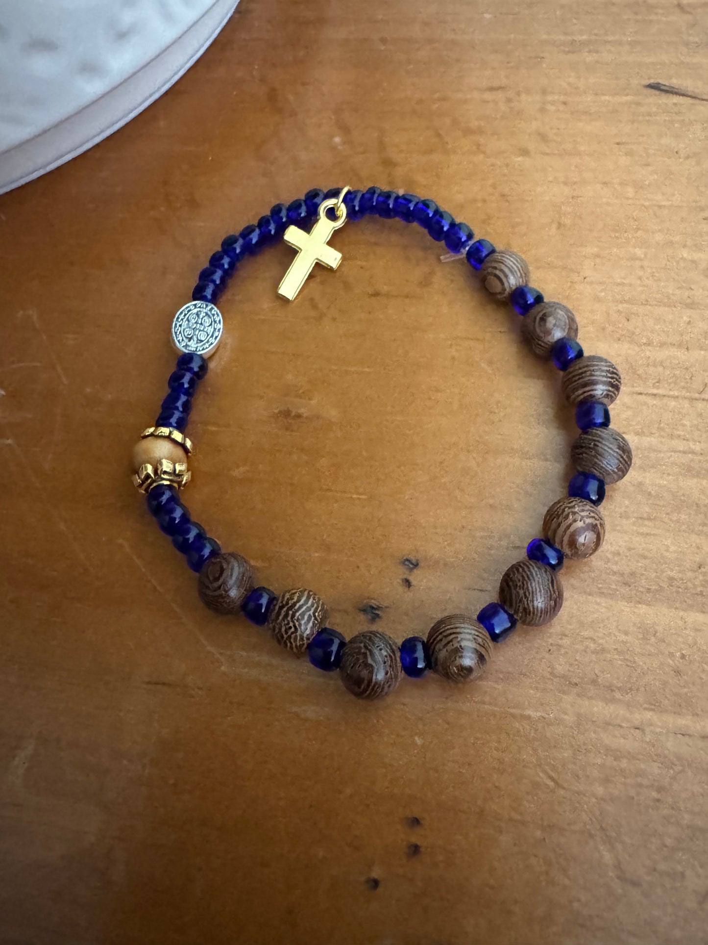 Handmade Dark Grained Wood Rosary Bracelet with Royal Blue Spacers & Gold Cross
