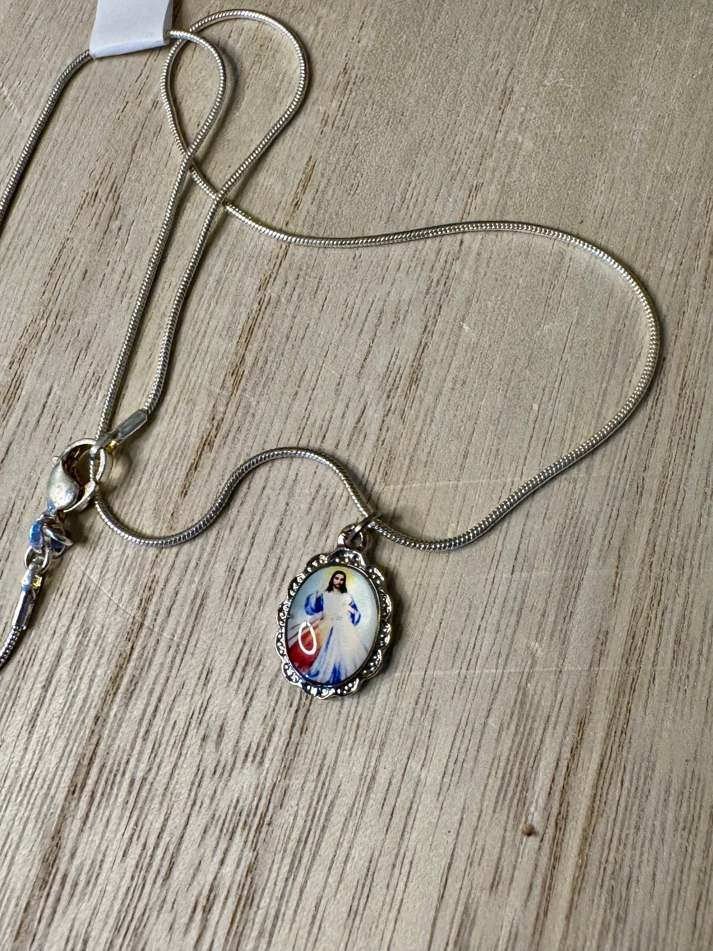 Necklace with a pendant on a wooden surface
